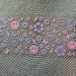 Purple flowers & smileys | UV DTF glass can wrap