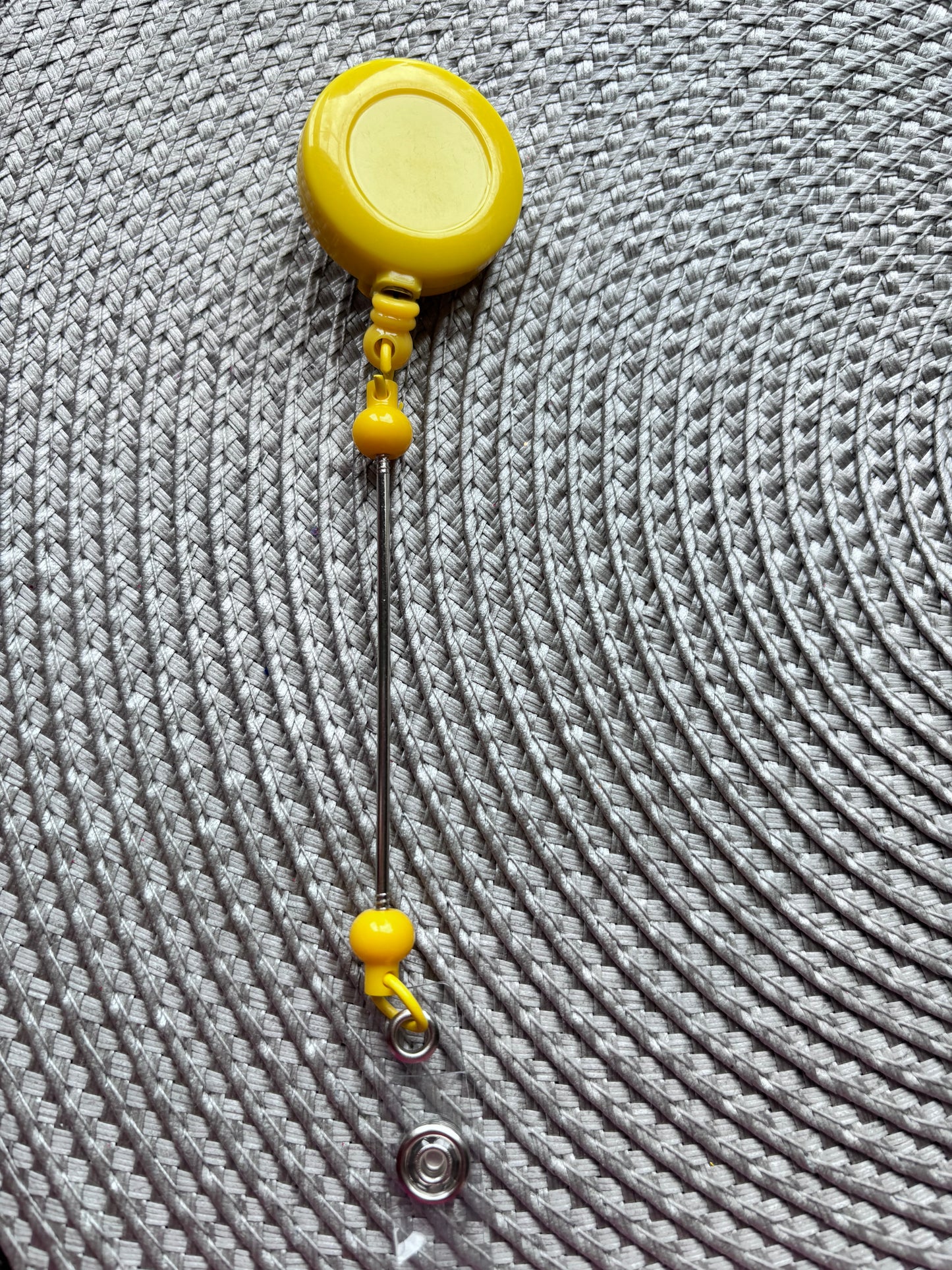 Yellow beadable bar badge reel