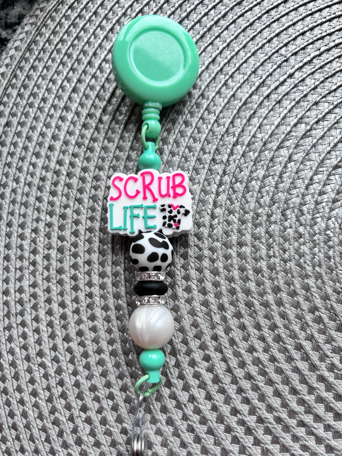 Cow print scrub life badge reel