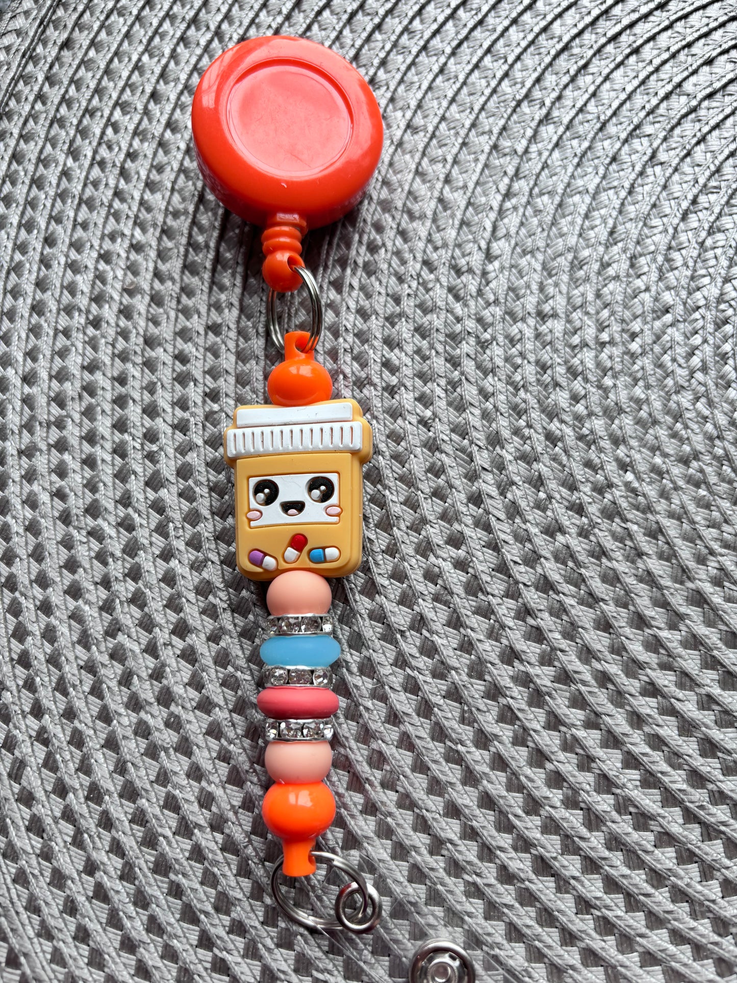 Happy pill bottle badge reel